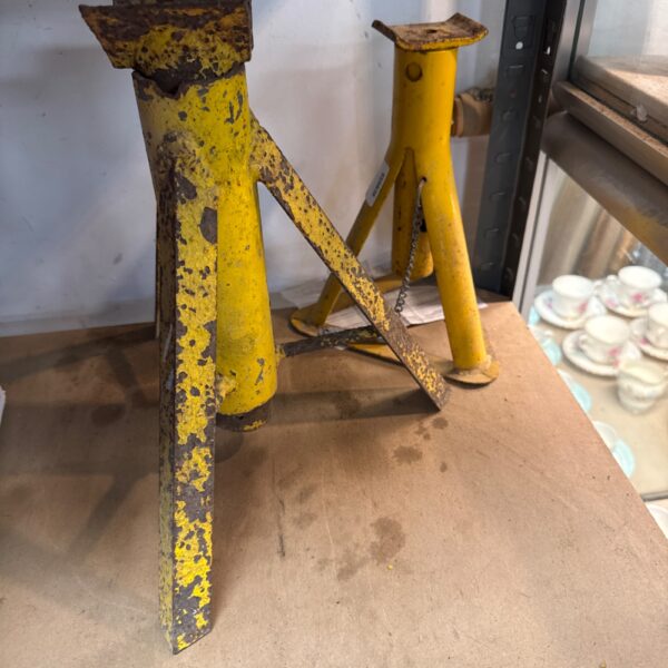 Pair of heavy-duty axle stands for vehicle maintenance and repair.