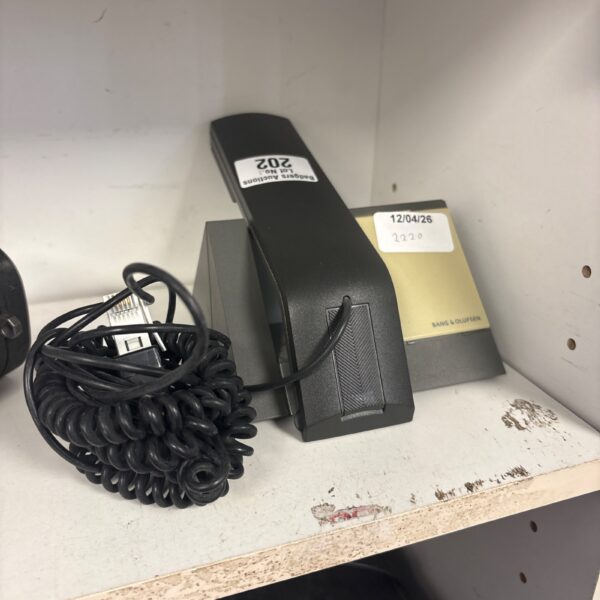 Vintage Bang and Olufsen retro telephone with coiled cord.