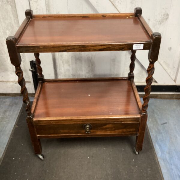 Vintage barley twist table with drawer for storage.