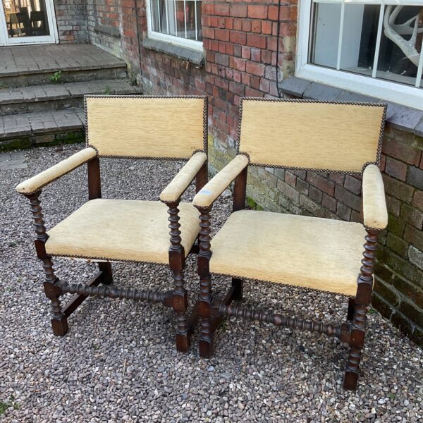 Pair of antique Baroque carver chairs with woven seats.