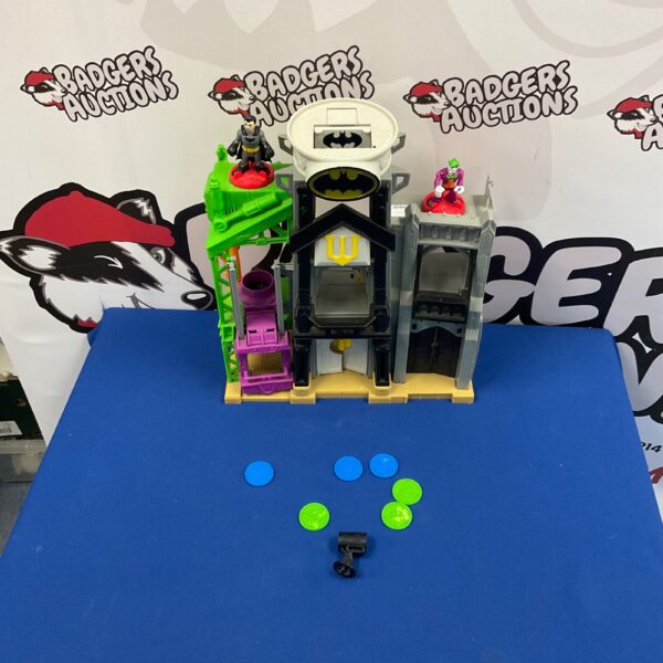 Detailed Batcave toy playset with Batman and Joker figures.