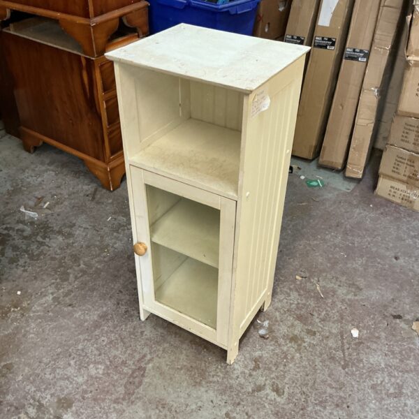 Wooden bathroom floor cabinet with single door and shelf.