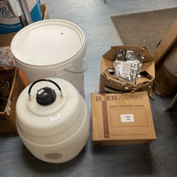 Beerworks brewing kit with fermentation vessel and ingredients.