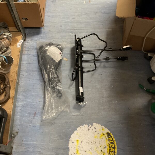 Adjustable bicycle rear cargo rack in as-found condition.