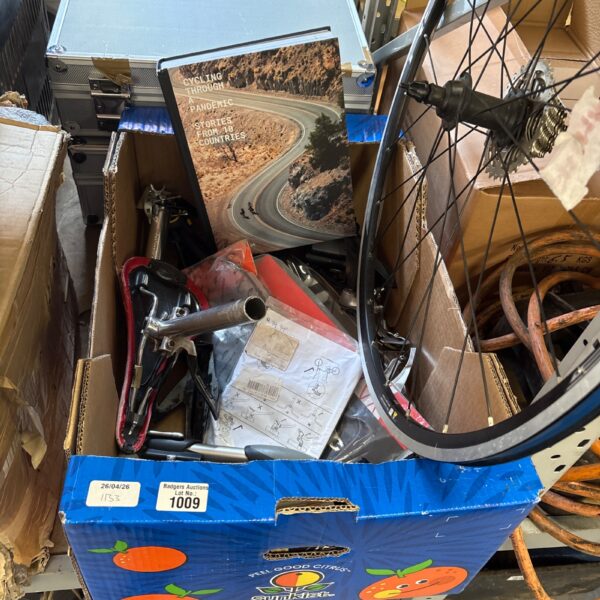 Assortment of used and new bike parts and accessories for repair.