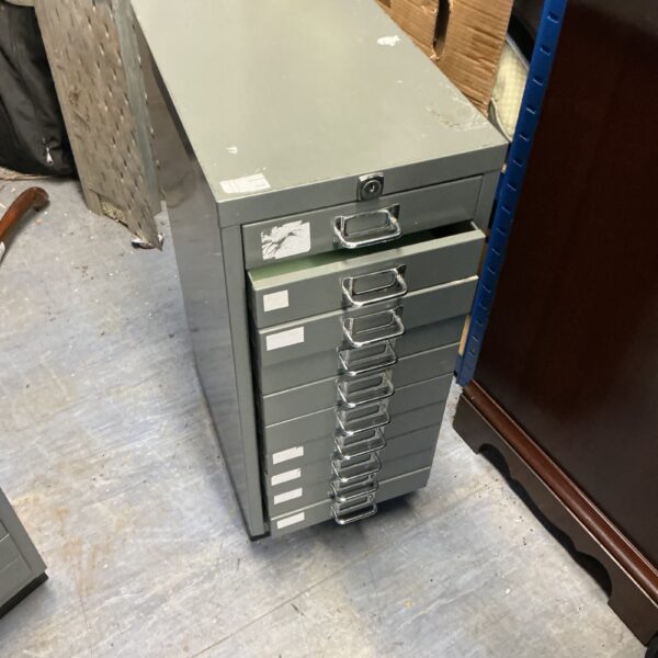 Vintage Bisley metal filing cabinets for office storage.