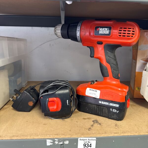 Black and Decker cordless drill with spare battery and charger.