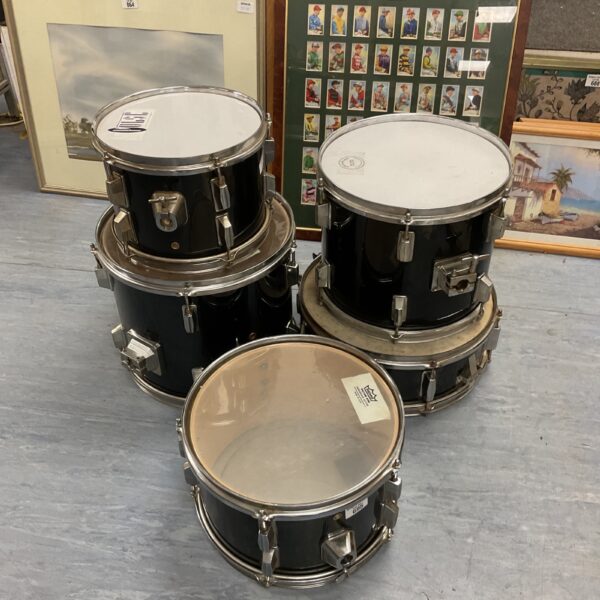Lot of five black drum kit drums for musicians.