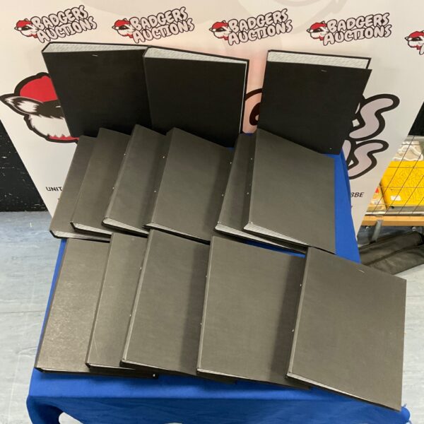 Lot of black file binders for document organisation.