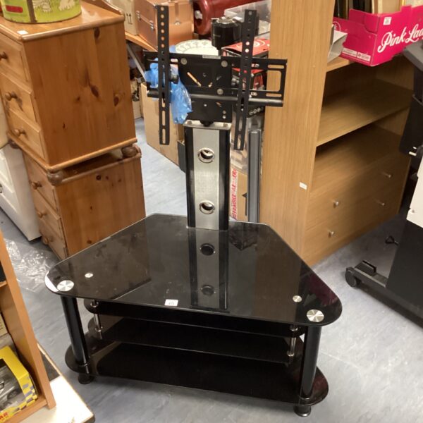 Black glass TV unit with bracket for flat screen television.