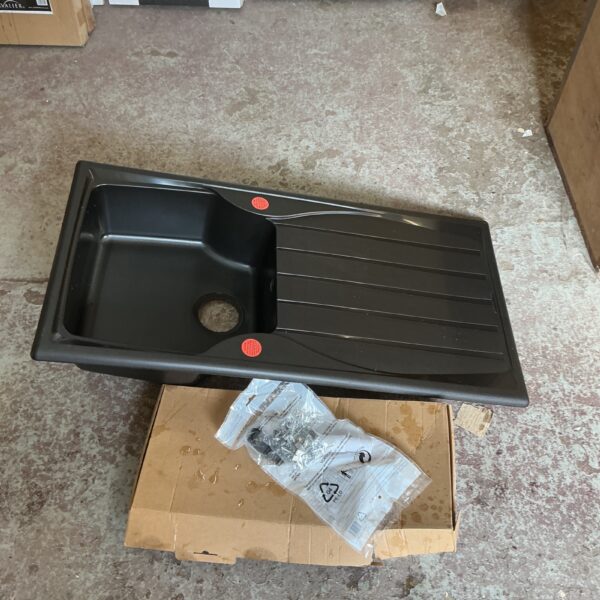 Black kitchen sink with drainer and fittings, used condition.