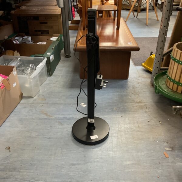 Black minimalist LED floor lamp for modern home lighting.