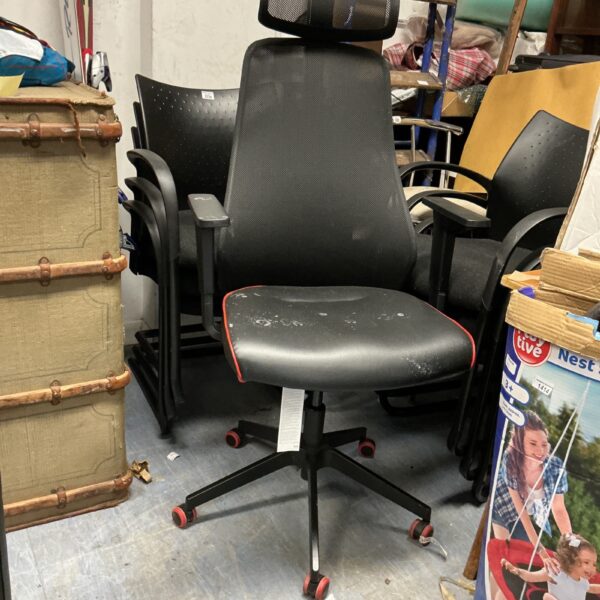 Black mesh office chair with adjustable height and five-star base.