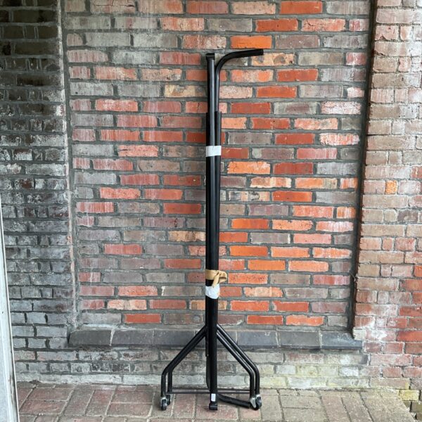 Black metal clothes rail for market or retail display.