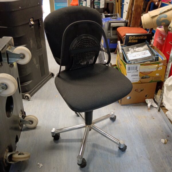 Black office chair with chrome base and swivel function.