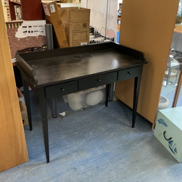 Black three-drawer side table with vintage charm.