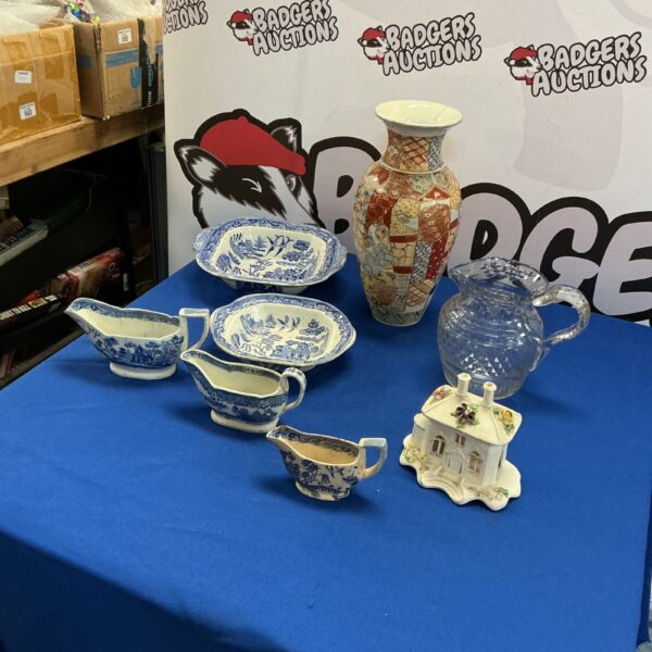 Vintage blue and white jugs with Japanese vase in a porcelain lot.
