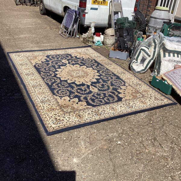 Large blue and cream geometric rug, approximately 9x6ft.