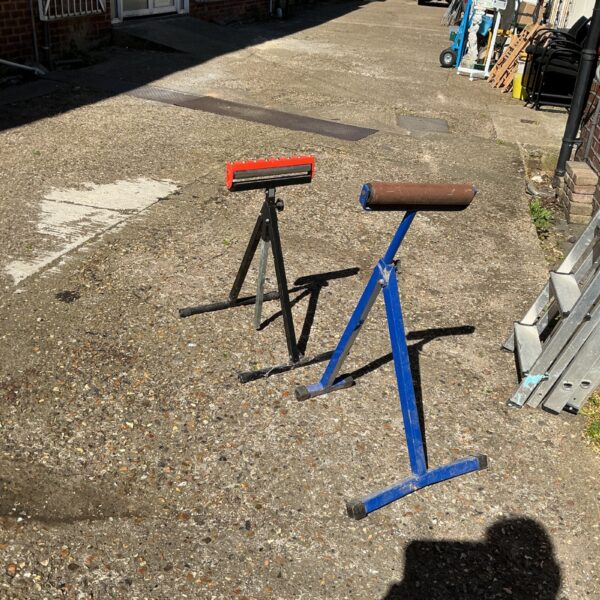 Blue metal folding trestles for workshop or portable use.