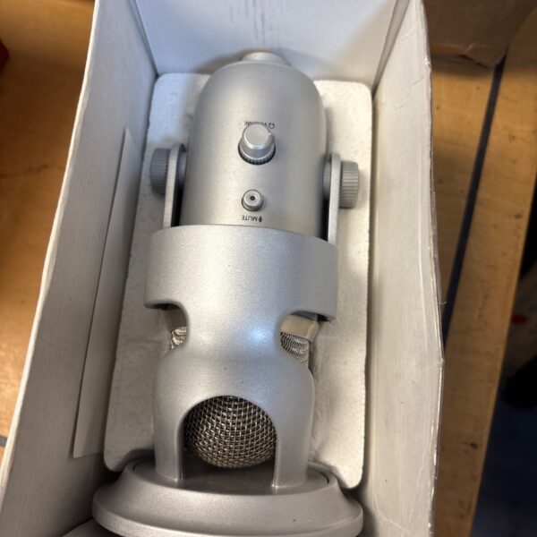 Blue Yeti USB microphone on a white surface.