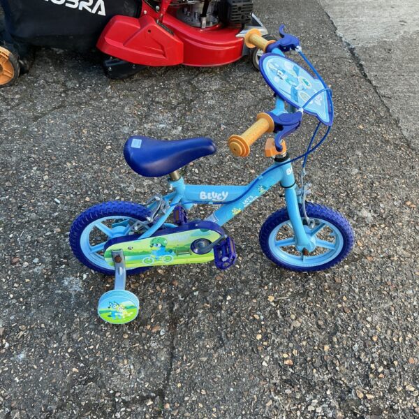 Side view of a blue Bluey character bicycle for children.