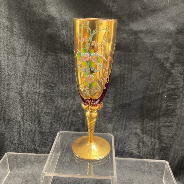 Vintage Bohemian ruby glass vase with gold gilt and enamel flowers.