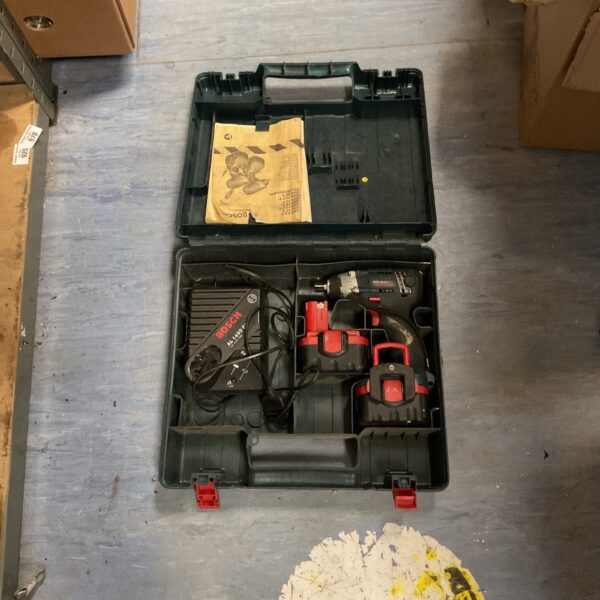 Bosch cordless drill set in open carrying case with charger.