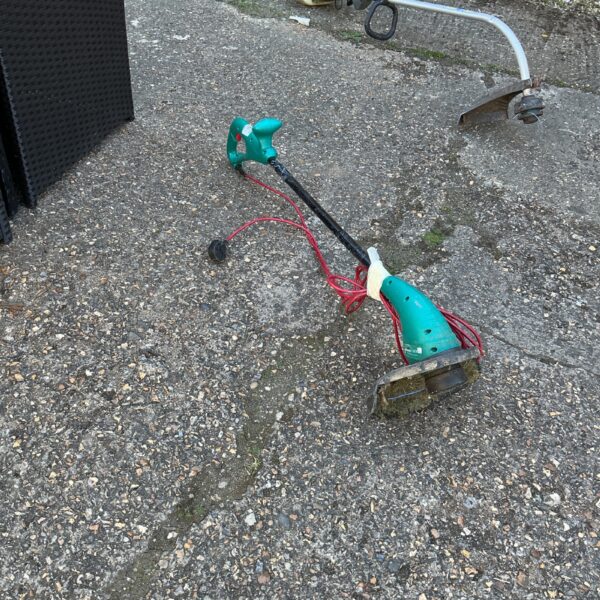Used Bosch electric garden strimmer for lawn and garden maintenance.