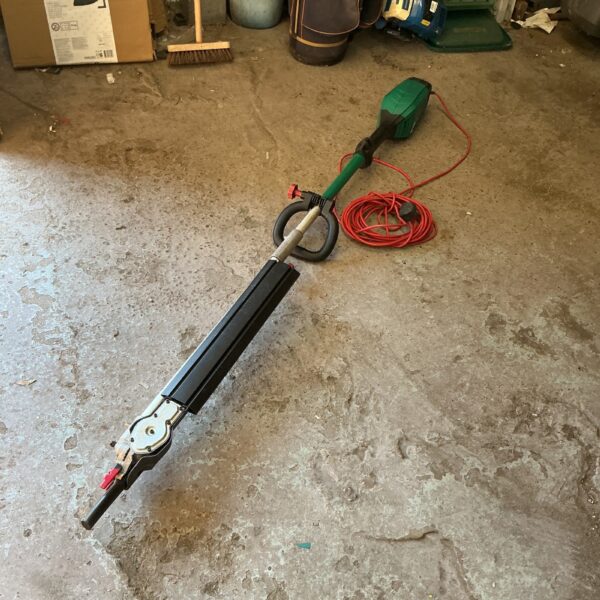 Used Bosch electric extending hedge trimmer for garden maintenance.