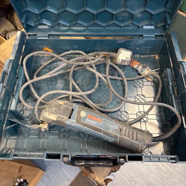 Used Bosch GOP 200 CE omni tool with accessories in a case.