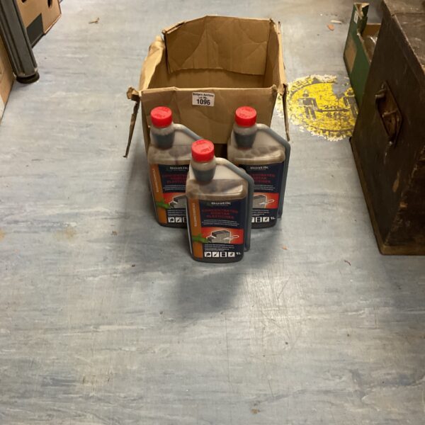 Several bottles of Bostik mortar plasticiser in a cardboard box.