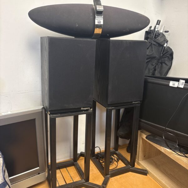 Bowers & Wilkins Zeppelin Air speaker with Rogers speakers on stands.