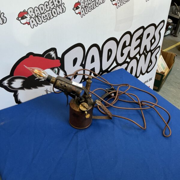 Vintage brass blow torch repurposed as a steampunk lamp.