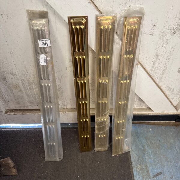 Vintage brass and chrome ventilation covers for air vents.