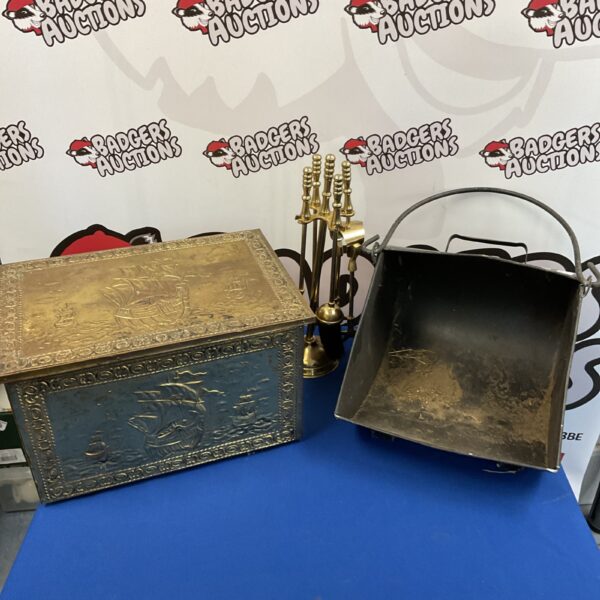 Vintage brass log box set with companion tools and coal scuttle.