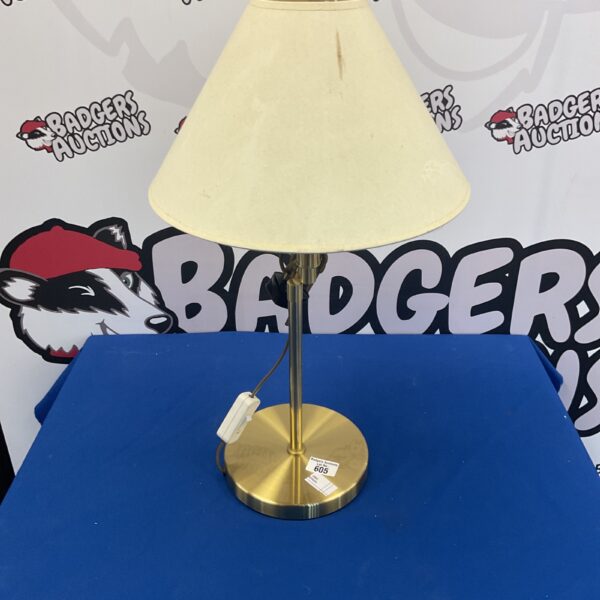 Vintage brass table lamp with a conical shade.