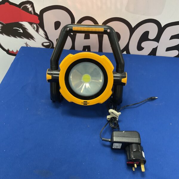 Brennenstuhl rechargeable sight light with charger on blue background.