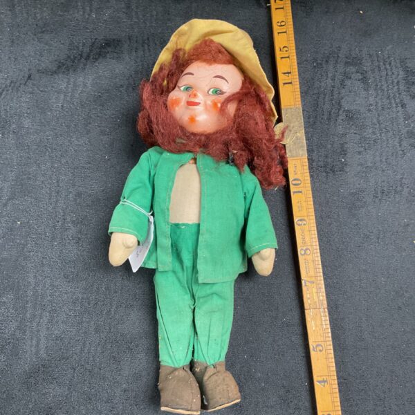 Vintage Brinns Tom Tucker doll in green outfit.