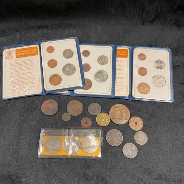 Britain's first decimal coin sets in presentation cases.