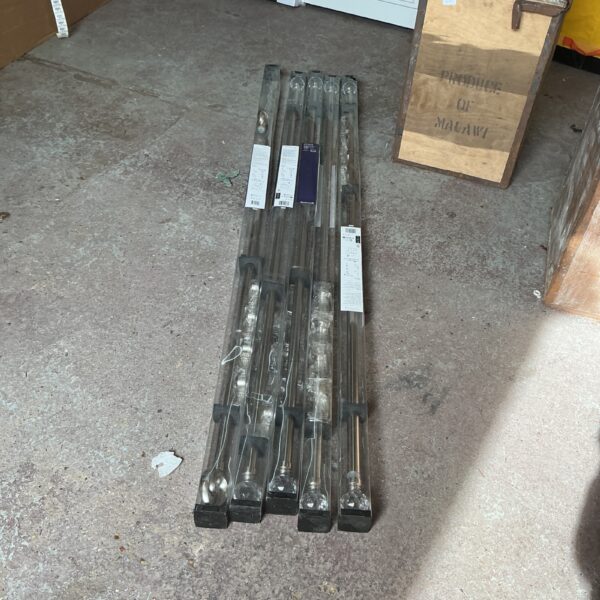 Brushed steel Athens curtain rods for window treatments.