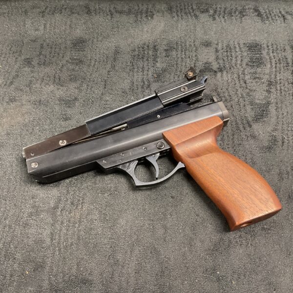 Vintage BSA .22 air pistol with wooden grip.