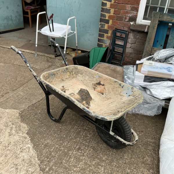 Used builders wheelbarrow for garden and construction work.