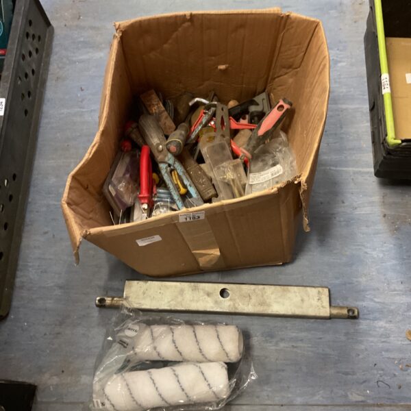 Assorted building supplies and hardware in a cardboard box.