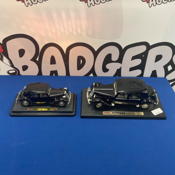 Two classic Citroen model cars by Burago and Maisto.