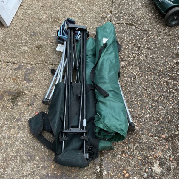 Five folding camping chairs stacked together, ready for outdoor use.