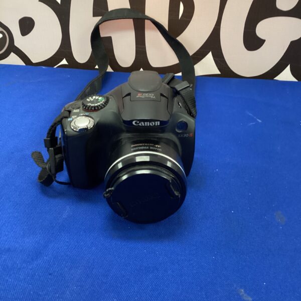 Vintage Canon PowerShot digital camera for collectors or parts.
