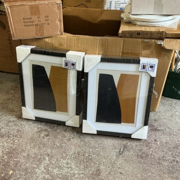 Two packs of new, blank canvas wall art ready for painting.