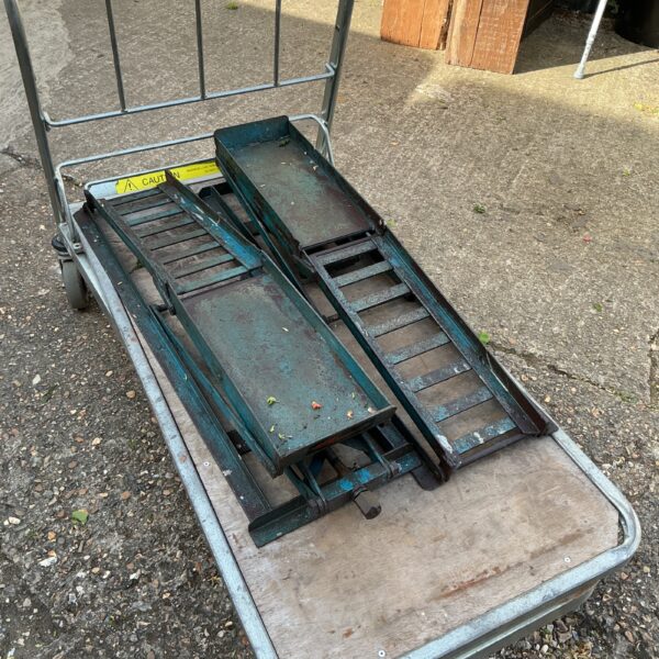 Heavy duty steel car ramps for garage use and vehicle maintenance.