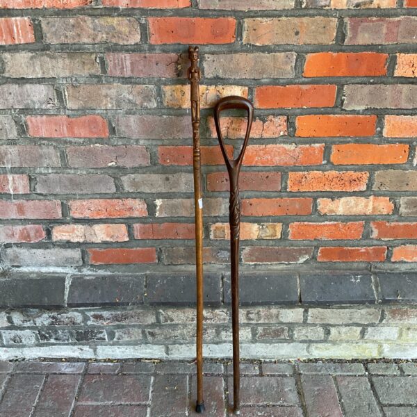 Vintage carved wooden walking stick with African tribal figure.