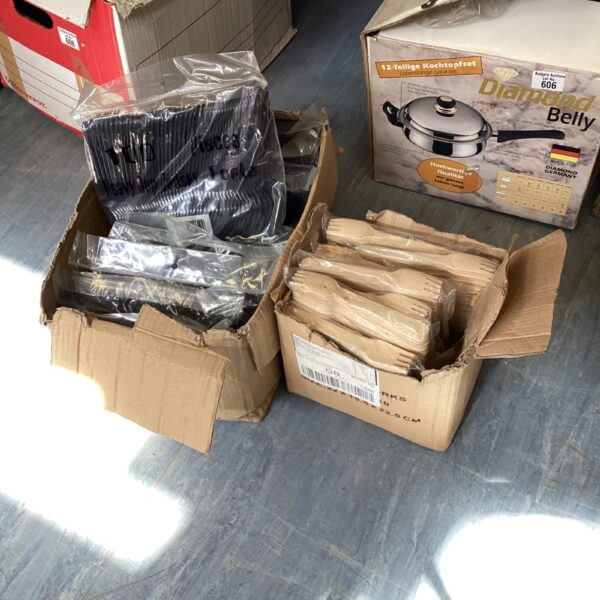 Catering cutlery lot with boxes of wooden and plastic forks.